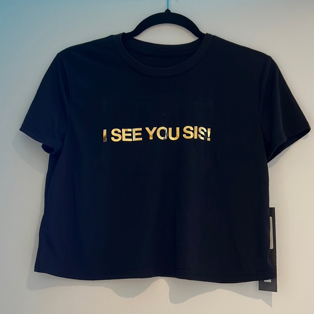 Never worn black graphic tee crop top. Tag is still on the top.
